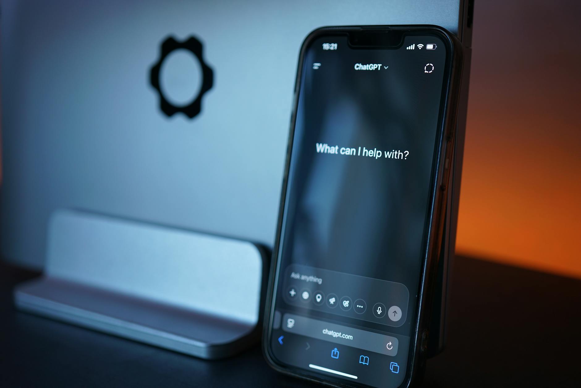 From Search Bar to Chat Box: AI Shopping in the US 2 close-up of a smartphone showing a shopping assistant chat interface recommending products, with a cart icon and price comparisons visible
